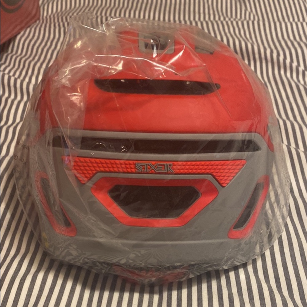 Bell - Mountain and road bike helmet. Size large. Brand new never worn. Red.